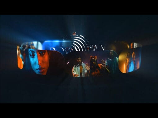 A dark, futuristic background highlights a glowing headset-shaped graphic displaying vivid scenes: a close-up of a woman’s blue-lit face, three people with hands raised in different gestures, and colorful portraits, all radiating light and energy.