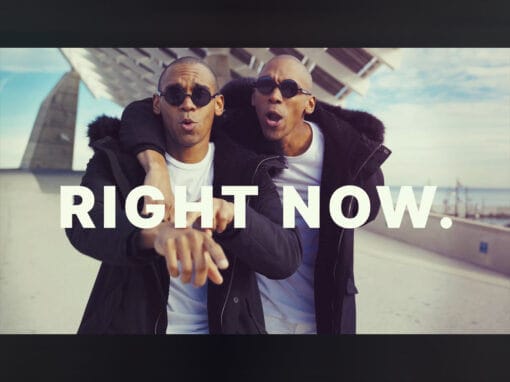 Is Your Brand Working For You? 9 Two men wearing sunglasses and black jackets stand side by side outdoors with one arm around the other's shoulders. Both point forward, and large white text across the image reads